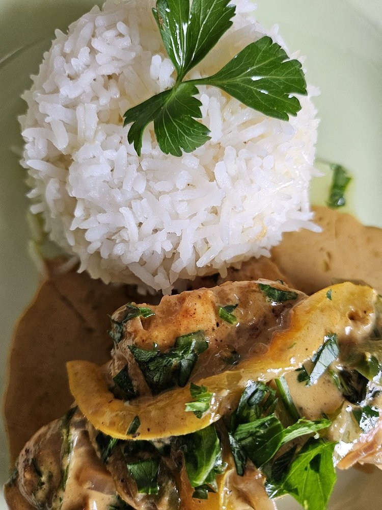 An Eduardo's grilled entrée with rice and fresh sides
